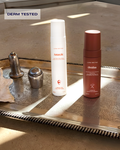 Antarctic hair shine rinse and Obsidian volumizing scalp scrub bottles displayed together on a silver tray, derm-tested