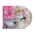 A Grey Cloud/Pebble Sunburst vinyl from Nightmare Of You with a pink and white marbled design partially slides out of its floral cover, featuring elegant white script—an ideal pick for album presale collectors.